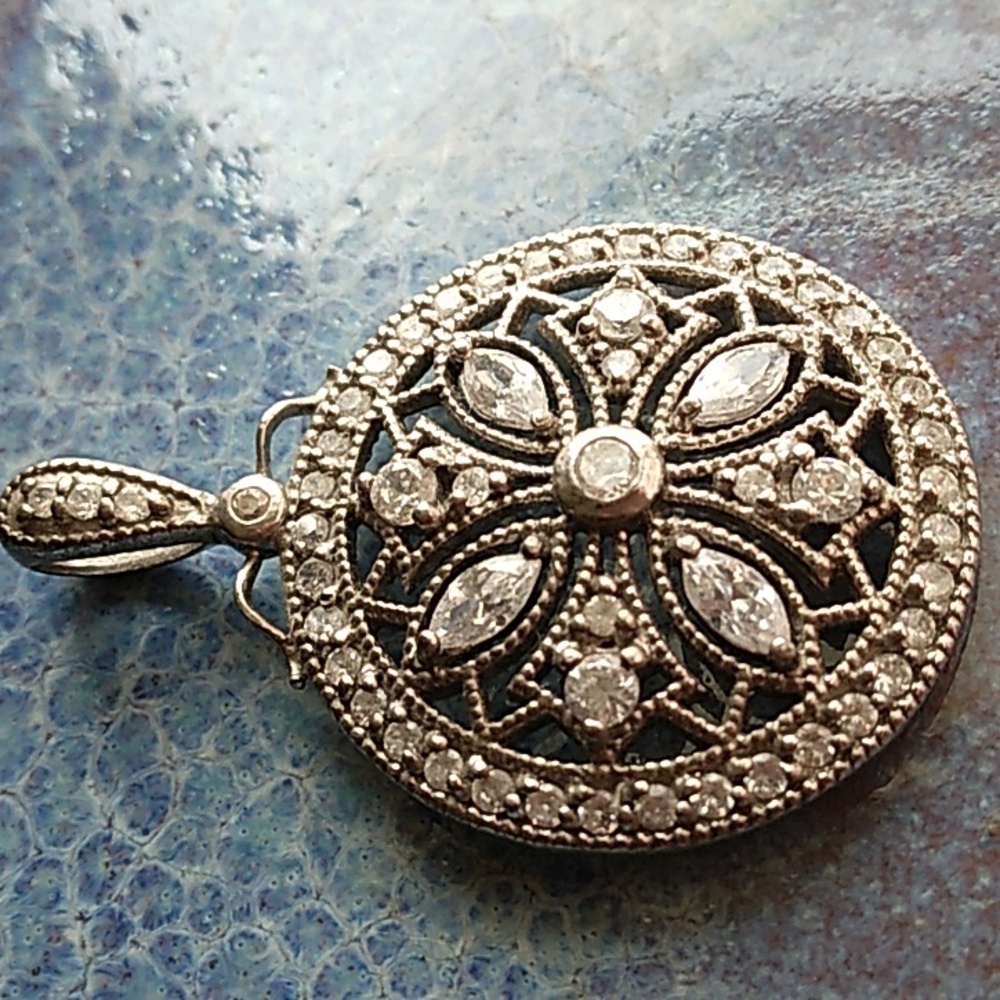 Sterling Silver and Cubic Zirconia Round Pendant with Intricate Design